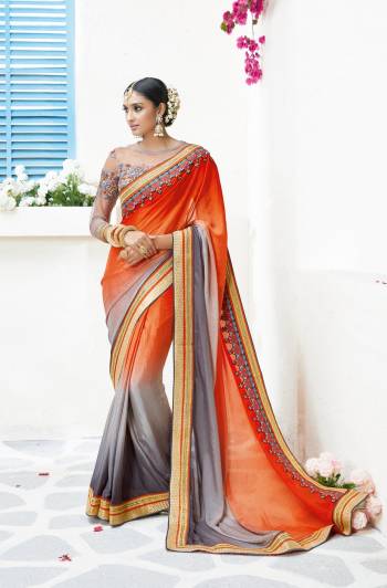 New And Unique Combination Is Here With This Saree In Orange And Grey Color Paired With Grey Colored Blouse. This Saree Is Fabricated On Silk Chiffon Paired With Art silk And Net Fabricated Blouse. This Designer Saree Is Easy To Drape And Carry All Day Long.