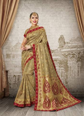 Add This Lovely Saree To Your Wardrobe In Unique Pale Khaki Color Paired With Pale Khaki Colored Blouse. This Saree Will Enhance Your Personality And Give A Rich Look Like Never Before As It Is Fabricated On Banarasi Art Silk.