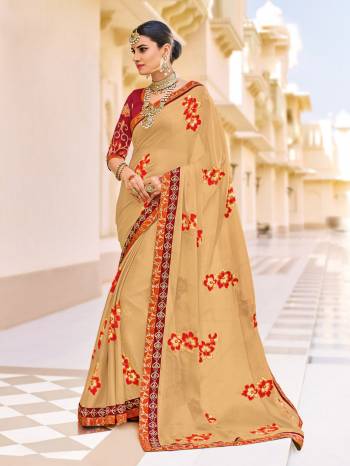 Flaunt a new ethnic look wearing this beige color silk chiffon saree. Ideal for party, festive & social gatherings. this gorgeous saree featuring a beautiful mix of designs. Its attractive color and designer patch, stone, floral design work over the attire & contrast hemline adds to the look. Comes along with a contrast unstitched blouse.