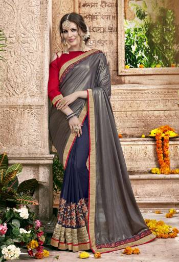 Here Is A Designer Saree In Grey And Navy Blue Color Paired With Contrasting Red Colored Blouse. This Saree Is Fabricated On Lycra And Georgette Paired With Art Silk Fabricated Blouse. Its Attractive Combination And Embroidery Will Earn You Lots Of Compliments From Onlookers.