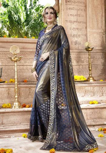 Shine Bright Wearing This Two Tone Saree In Navy Blue And Gold Paired With Navy Blue Colored Blouse. This saree Is Fabricated On Shimmer Georgette And Net Paired With Art Silk Fabricated Blouse. This Saree Is Easy To Drape And Carry All Day Long.