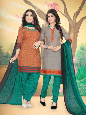 Grab This Two-In-One Dress Material With Two Different Tops. One Top Is In Orange Color And Another In Grey Paired With Green Colored Bottom And Dupatta. Both Its Top And Bottom Are Fabricated On Cotton Paired With Chiffon Dupatta. Buy This Dress Material Now.