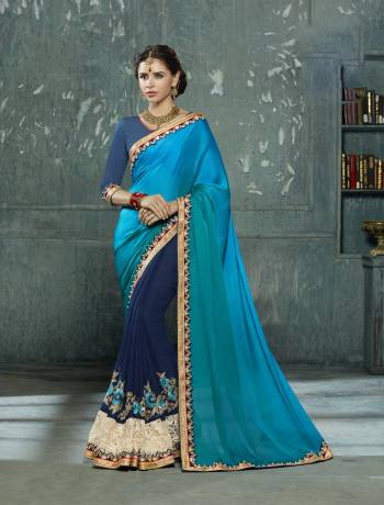 Go With The Shades Of Blue With This Saree In Two Shades Of Blue Paired With Blue Colored Blouse. This Saree Is Fabricated On Satin And Georgette Paired With Art Silk Fabricated Blouse. This Saree Is Easy To Drape And Also Durable. Buy This Saree Now.