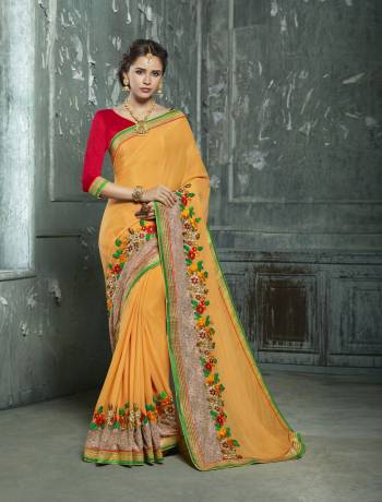 Shine Bright Wearing This Saree In Orange Color Paired With Contrasting Red Colored Blouse. This Saree Is Fabricated On Silk Chiffon Paired With Art Silk Fabricated Blouse. This Saree Is Beautified With Contrasting Colored Embroidery Over The Lace Border.