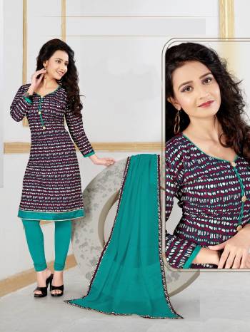 Here Is A Pretty Casual Suit In Wine Color Paired With Contrasting Sea Green Colored Bottom And Dupatta. Its Top and Bottom Are Fabricated On Cotton Paired With Chiffon Dupatta. Buy This Dress Material Now.