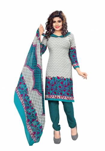 Here Is Quite Simple Dress Material For Your Daily Wear In Pale Grey Colored Top Paired With Teal Blue Colored Bottom And Multi Colored Dupatta. Its Top and Bottom Are Fabricated On Cotton Paired With Chiffon Dupatta. Buy This Dress Material Now.