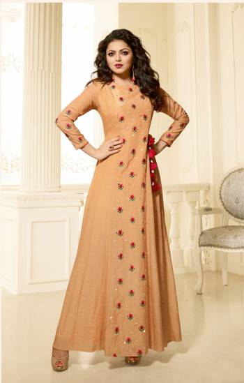 Here Is A Beautiful Designer Gown In Elegant Beige Color. This Pretty Gown Is Fabricated On Cotton Satin Beautified With Small Floral Embroidery Over It. This Readymade Gown Is Available In Many Sizes. Buy It Now.