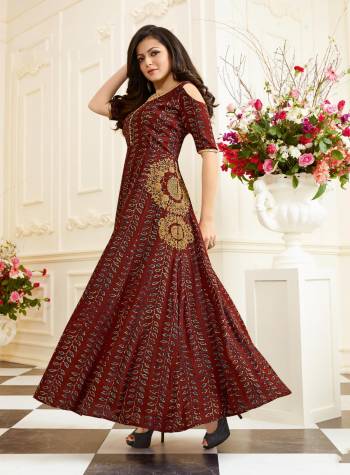 Grab This Readymade Gown For Your Outwear In Brown Color Fabricated On Art Silk. It Is Beautified With Prints And Embroidery And Cold Shoulder Pattern Which Is Too Much In Trend. Buy This Pretty Gown Before The Stock Ends.