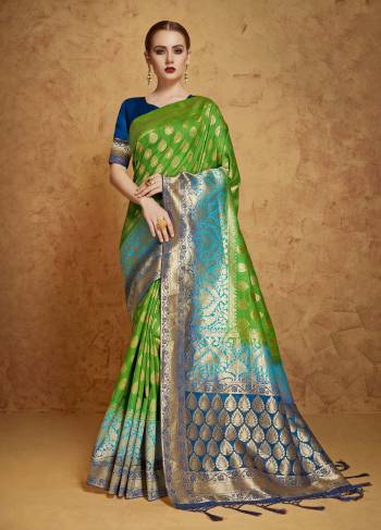 Grab This Designer Banarasi Saree In Green Color Paired With Contrasting Royal Blue Colored Blouse. This Saree And Blouse Are Fabricated On Banarasi Art Silk Beautified with Weave All Over It. It IS Easy To Drape and Carry All Day Long.