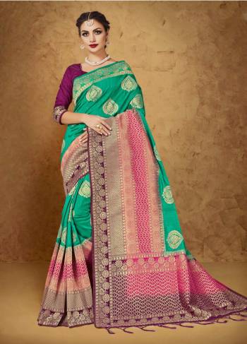 Ad This Lovely Shade Of Green To Your Wardrobe With This Banarasi Saree In Sea Green Color Paired With Contrasting Purple Colored Blouse. This Saree And Blouse Are Fabricated On Banarasi Art Silk. It Is Light In Weight And Easy To Carry All Day Long.