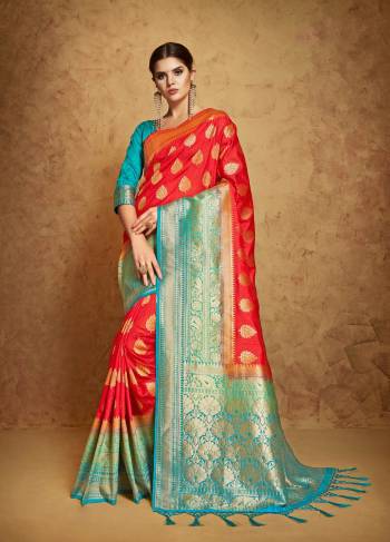 Adorn The Pretty Angelic Look Wearing This Designer Banarasi Saree In Red Color Paired With Contrasting Turquoise Blue Colored Blouse. This Saree And Blouse Are Fabricated On Banarasi Art Silk Which Even Gives A Rich Look To Your Personality.