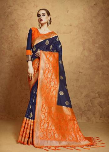 Enhance Your Personality Wearing This Saree In Navy Blue And Orange Colored Saree Paired With Contrasting Orange Colored Blouse. This Saree And Blouse Are Fabricated On Banarasi Art Silk Beautified With Weave All Over It. Buy This Beautiful Designer Saree Now.