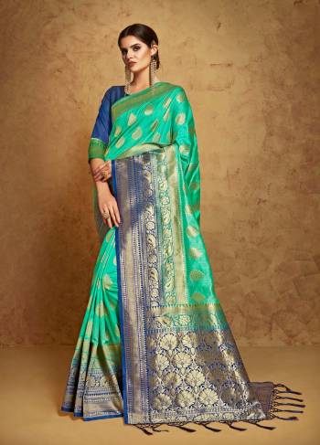 Shades Of Blue Always Gives A Beautiful Look, So Grab This Banarasi Saree In Aqua Blue Color Paired With Royal Blue Colored Blouse. This Saree and Blouse are Fabricated On Banarasi Art Silk Beautified With Weave All Over It.