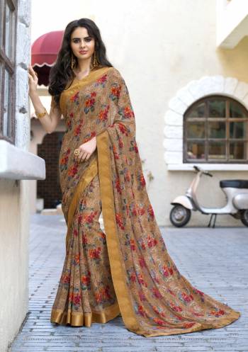 Flaunt Your Rich and Elegant Taste Even In Prints With This Saree In Brown Color Paired With Light Brown Colored Blouse. This Saree Is Fabricated On Georgette Paired With Satin Fabricated Blouse. It Is Beautified With Floral Prints All Over The Saree. Buy This Saree Now.