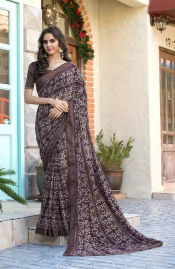 Look Elegant Wearing This Saree In Dark Brown Color Paired With Dark Brown Colored Blouse. This Saree Is Fabricated On Georgette Paired With Satin Fabricated Blouse. It Has Pretty Simple Prints All Over The Saree. Buy Now.