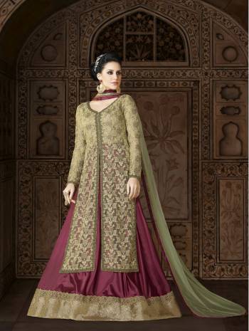 Another Beautiful Indo-Westrn Suit Is Here Mint Green Colored Top Paired With Contrasting Magenta Pink Lehenga And Mint Green Colored Dupatta. Its Top Is Fabricated On Net Paired With Paper Art Silk Lehenga And Net Dupatta. Its All Three Fabrics Ensures Superb Comfort All Day Long. Buy Now.