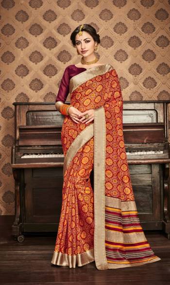 Add This New Color To Your Wardrobe In Rust Orange Color Paired With Contrasting Wine Colored Blouse. This Saree And Blouse Are Fabricated On Kota Art Silk Beautified with Prints All Over It. This Saree Will Give A Rich And Elegant Look To Your Personality.