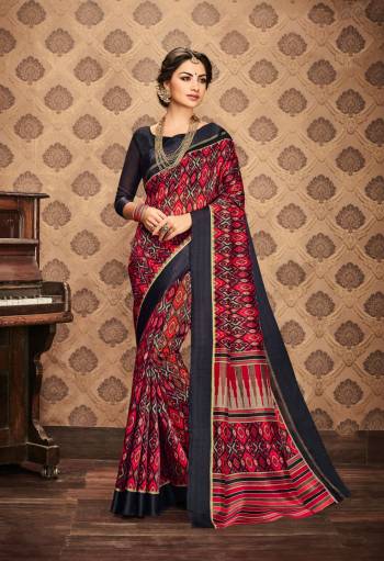 Enhance Your Beauty Wearing This Saree In Red And Grey Color Paired With Dark Grey Colored Blouse. This Saree And Blouse Are Fabricated On Kota Art Silk Beautified With Prints All Over. This Saree Is Light In Weight And Easy To Carry All Day Long. 