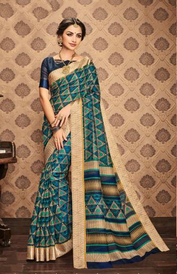 Celebrate This Festive Season With Rich Elegance With This Saree In Blue And Beige Color Paired With Navy Blue Colored Blouse. This Saree And Blouse Are Fabricated On Kota Art Silk Beautified With Geometric And Abstract Prints All Over It.