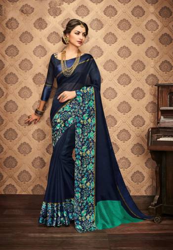 Enhance Your Personality Wearing This Saree In Navy Blue Color Paired With Navy Blue Colored Blouse. This Saree And Blouse Are Fabricated On Kota Art Silk Beautified With Floral Prints Over The Border. Buy Now.