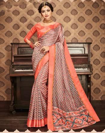 Rare And Unique Combination Is Here With This Saree In Grey And Orange Color Paired With Orange Colored Blouse. This Saree And Blouse Are Fabricated On Kota Art Silk Beautified With Intricate Simple Prints All Over It. 