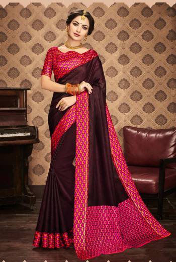 Most Deamanding Color Of The Season Is Here With This Saree In Wine Color Paired With Pink And Orange Colored Blouse. This Saree And Blouse Are Fabricated On Kota Art Silk. Its Fabrics Ensures Superb Comfort All Day Long. Buy Now.