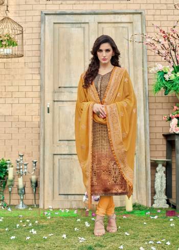 Beautiful Combination Is Here With This Straight Cut Suit In Light Brown Color Paired With Contrasting Musturd Yellow Colored Bottom And Dupatta. Its Top Is Fabricated On Satin Silk Paired With Crepe Bottom And Chiffon Dupatta. It Has Beautiful Prints And Embroidery Which Will Earn You Lots Of Compliments From Onlookers.