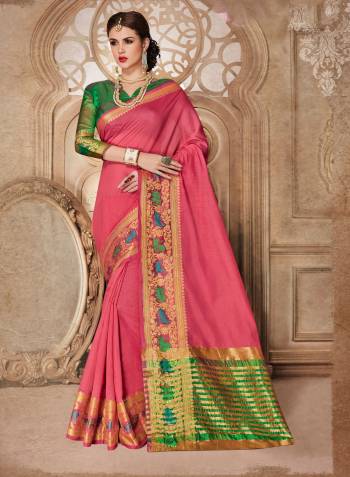 Look Pretty Wearing This Pink Colored Saree Paired With contrasting Green Colored Blouse. This Saree Is Fabricated On Cotton Silk Paired With Art Silk Fabricated Blouse. Its Bright Colors And Weave Over The Border Is Making The Saree Attractive.