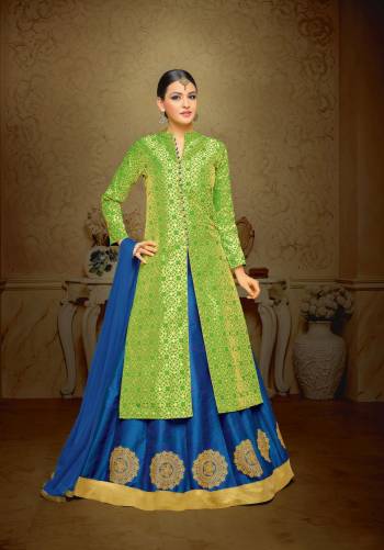 Celebrate This Festive Season Wearing This Indo-Western Suit In Green Color Paired With Contrasting Blue Colored Lehenga And Dupatta. Its Top Is Fabricated On Jacquard Silk Paired With Art Silk Lehenga And Chiffon Dupatta. Its Lehenga Is Beautified With Embroidered Motifs Which Looks Simple and Elegant.