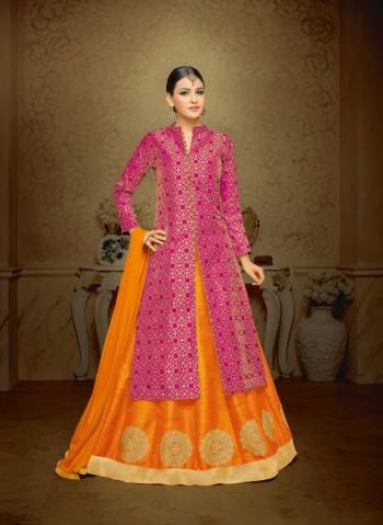 Attract All Wearing This Attractive Combination With This Rani Pink Colored Top Paired With Contrasting Orange Colored Lehenga And Dupatta. Its Top Is Fabricated On Jacquard Silk Paired With Art Silk Lehenga And Chiffon Dupatta. Its Colors And Design Will Give Unique Look To Your Personality.