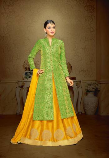 More Colorful Your Wear, More Attractive You Look. So Grab This Semi-Stitched Indo-Western Suit In Green Color Paired With Contrasting Yellow Colored Lehenga And Dupatta. Its Top Is Fabricated On Jacquard Silk Paired With Art Silk Lehenga And Chiffon Dupatta. It Has Embroidery Over The Lehenga. Buy Now.