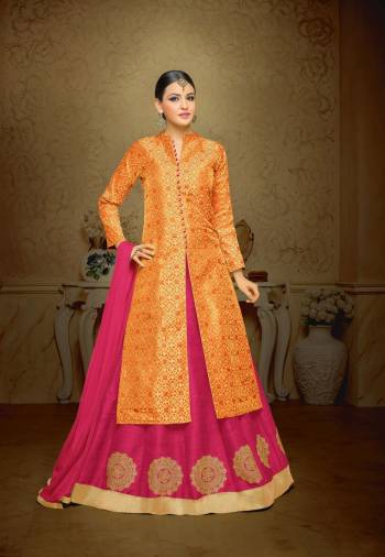 Bright And Visually Appealing Colors Are Here With This Indo-Western Suit In orange Colored Top Paired With Contrasting Rani Pink Colored Lehenga And Dupatta. Its Top Is Fabricated On Jacquard Silk Paired With Art Silk Lehenga And Chiffon Dupatta. All Three Fabrics Ensures Superb Comfort All Day Long.