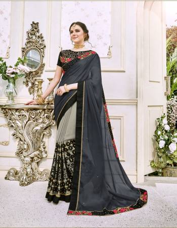 Look Elegantly Beautiful Wearing This Saree In Shaded Grey Color Paired With Black Colored Blouse. This Saree Is Fabricated On Silk Chiffon Paired With Art Silk Fabricated Blouse. This  Designer Saree Is easy To Drape And Carry All Day long.