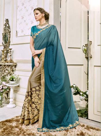 Add This Saree In Your Wardrobe For The Upcoming Function At Your Place In Blue And Beige Color Paired With Blue Colored Blouse. This Saree Is Fabricated On Crepe Silk Paired With Art Silk Fabricated Blouse. Buy This Now.