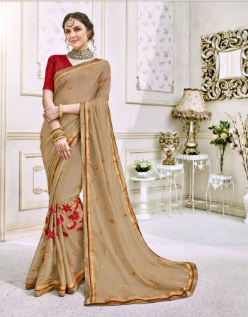 Simple And Elegant Is The Look That Every Lady Demands For So Grab This Elegant Saree In Beige Color Paired With Red Colored Blouse. This Saree Is Fabricated On Silk Chiffon Paired With Art Silk Fabricated Blouse. It Is Beautified With Contrasting Embroidery Over The Saree Panel.