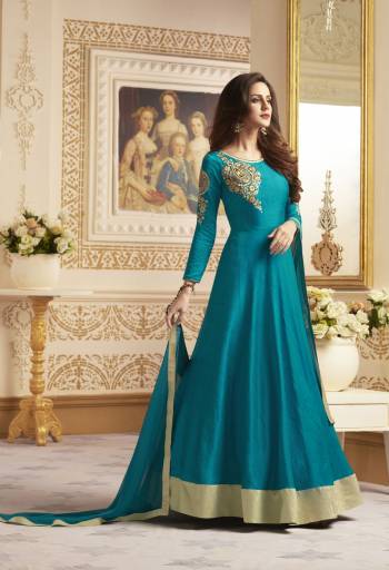 Elegant Designer Look Is Here With Readymade Floor Length Suit In Blue Color Paired With Blue Colored Bottom And Dupatta. Its Top Is Fabricated On Art Silk Paired With Santoon Bottom And Chiffon Dupatta. It Has Beautiful Embroidery Over The Sleeves And Yoke. Buy It Now.