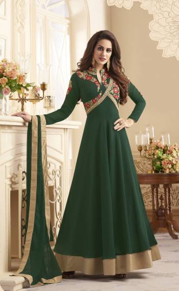 Look Sleek And Elegant Wearing This Readymade Designer Floor Length Suit In Green Color Paired With Green Colored Bottom And Dupatta. Its top Is Fabricated On Georgette Paired With Santoon Bottom And Chiffon Dupatta. It Has Multi Colored Embroidery Over Its Yoke Making The Suit Attractive.