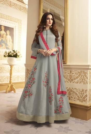 Elegance Is The Key To Beauty, So Grab This Elegant And Rich Looking Designer Floor Length Suit In Grey Color Paired With Grey Colored Bottom And Dupatta. Its Top Is Fabricated On Satin Silk Paired With Santoon Bottom And Chiffon Dupatta. It Has Contrasting Embroidery Over The Top. Buy This Readymade Suit Now.