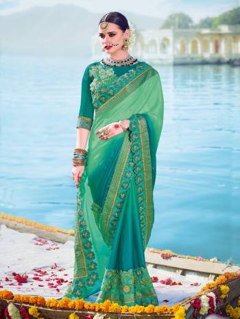 marvelously charming is what you will look at the next wedding gala wearing this beautiful shades of green color two tone bright georgette with padding saree. Ideal for party, festive & social gatherings. this gorgeous saree featuring a beautiful mix of designs. Its attractive color and designer embroidered design, patch design, stone, beautiful floral design work over the attire & contrast hemline adds to the look. Comes along with a contrast unstitched blouse.