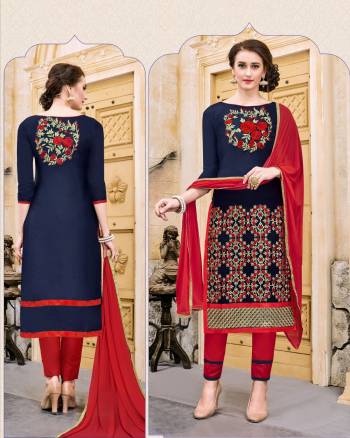 IF Your Are An Working Lady Than This Suit Is Perfect For Your Wrok Place Which Is In Navy Blue Color Paired With Contrasting Red Colored Bottom And Dupatta. Get This Dress Material Stitched As Per Your Comfort To Wear All Day Long At Your Work Place.