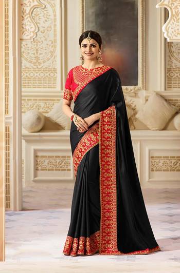 Enhance Your Beauty Wearing This Saree In Black Color Paired With Red Colored Blouse. This Pretty Designer Saree Is Fabricated On Silk Paired With Art Silk Fabricated Blouse. Both The Fabrics Ensures Superb Comfort And Give You A Rich Look. Buy This Saree Now.