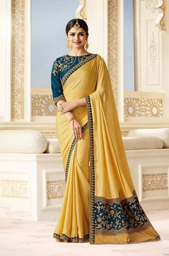 Yellow Color Induces Perfect Summery Appeal To Any Outfit. So Grab This Saree In Yellow Color Paired With Contrasting Blue Colored Blouse. This Saree Is Fabricated On Silk Paired With Art Silk Fabricated Blouse. This Designer Saree Has Pretty Embroidery Over The Blouse And Saree Pallu. 