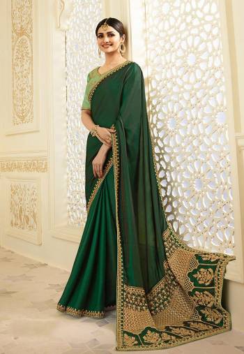 Shades Of Green Always Gives A Fresh And Lovely Look, So Grab This Saree In Dark Green Color Paired With Pastel Green Colored Blouse. This Saree Is Fabricated On Silk Paired With Pastel Green Colored Blouse. This Lovely Combination And Detailed Embroidery Will Earn You Lots Of Compliments From Onlookers.