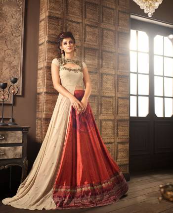 Elegant Style Is Here With Such Indo-Western Suit In Beige Colored Top Paired With Rust Colored Lehenga And Beige Dupatta. Its Attractive Cut Out Pattern With Embroidery Will Earn You Lots Of Compliments From Onlookers.