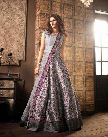 Unique Patterned Indo-Western Suit Is Here In Grey Color. It Has Beautiful Cape Pattern With Embroidery Over The Border And Printed Lehenga. This Dress Will Definitely Earn You Lots Of Compliments From Onlookers.