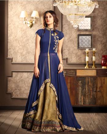 Grab This Lovely Indo-Western Dress In Blue Colored Top Paired With Beige Colored Lehenga And Blue Dupatta. Its High Low Patterned Top Is Ensures Superb Comfort All Day Long. Buy This Readymade Suit Now.