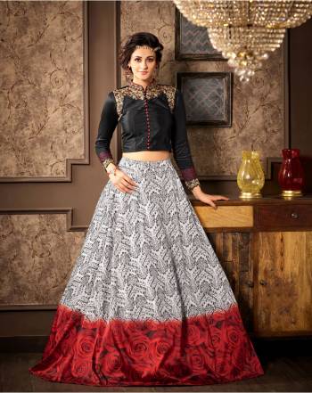 Royal Elegance Is Here With This Indo-Western Suit In Black Colored Top Paired With Grey Lehenga and Black Dupatta. Its Embroidered Top And Printed Lehenga Has A Great Combination Which Will Earn You Lots Of Complieents From Onlookers.