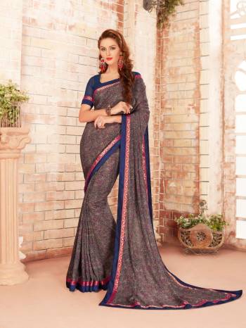 Go Colorful With This Multi Colored Saree Paired With Blue Colored Blouse. This Saree Is Fabricated On Silk Georgette Paired With Georgette Fabricated Blouse. It Has Detailed Intricate Prints All Over The Saree. Buy This Pretty Saree Now. 