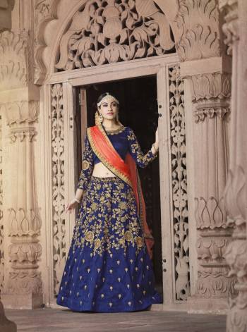 Attract All Wearing This Attractive Lehenga Choli Blue Color Paired With Contrasting Orange Colored Dupatta. Its Blouse And Lehenga Are Fabricated On Art Silk Paired With Chiffon Dupatta. This Designer Lehenga Also Ensures Superb Comfort All Day Long. Buy Now.