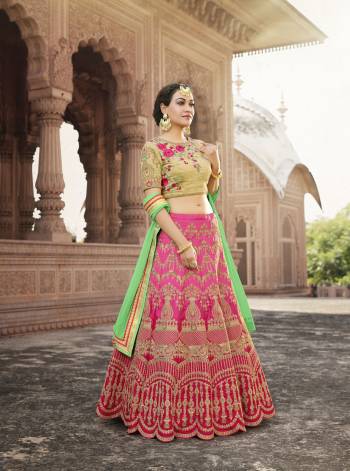 Go Colorful With This Lehenga Choli In Beige Colored Blouse Paired With Pink Colored Lehenga And Contrasting Green Colored Dupatta. This Lehenga Choli Is Fabricated On Art Silk Paired With Chiffon Dupatta. It Has Heavy contrasting Embroidery Making The Lehenga More Colorful And Attractive.